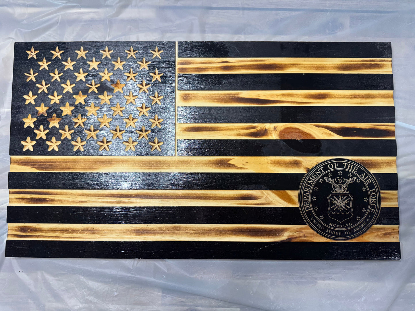 Wooden American flag with Department of the Air Force emblem on a wood background